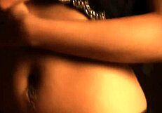 Indian brunette dances seductively while undressing and teasing.