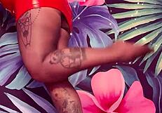 teasing in ripped pantyhose and latex dress