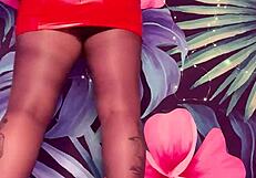 teasing in ripped pantyhose and latex dress