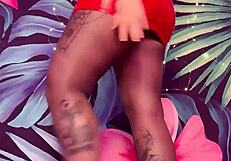 teasing in ripped pantyhose and latex dress