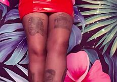 teasing in ripped pantyhose and latex dress