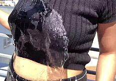 Two Amateur Girls Get Soaking Wet On Balcony