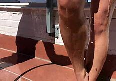 Two Amateur Girls Get Soaking Wet On Balcony