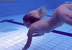 Teen babe Elena Prokva shows her big hot tits and a slender body in the water