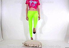 Beautiful legged woman steps on cushion with high heels, showcasing her shoe fetish.