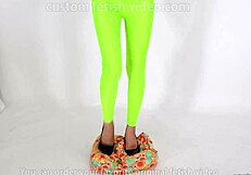 Beautiful legged woman steps on cushion with high heels, showcasing her shoe fetish.