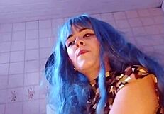 wife humiliates her old cuckold husband in femdom scene.