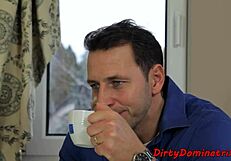 pretty dominatrix having fun with a cucumber in bondage