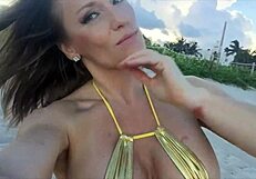 jillian hits the beach in a tiny gold bikini 😍