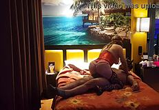 Peruvian girl in red corset poses with her amateur couple at home