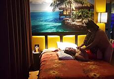 Peruvian girl in red corset poses with her amateur couple at home