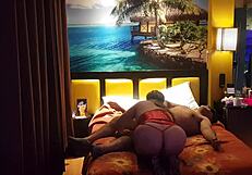 Peruvian girl in red corset poses with her amateur couple at home