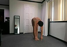 Wednesday stretches naked in casual routine
