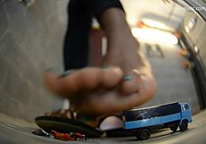 Ms. Montana crushes little 18+ bugs under her feet.