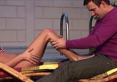 He couldn't resist covering her feet in the warm liquid.