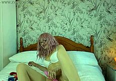 Granny in white stockings performs wet masturbation session