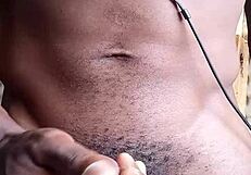 Home video of some unprofessional naked woman fondling huge Black penis and ejaculating on the floor