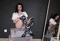 Domino rubs her hairy pussy before the mirror