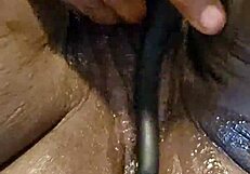 Ebony self pleases her ass