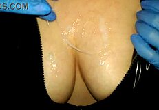 Busty babe gives wet handjob to thick cock for creamy load on 36dd tits in latex