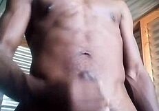 She kneels to masturbate a monster black cock with big balls