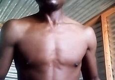 She kneels to masturbate a monster black cock with big balls