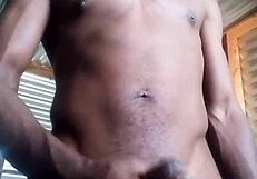 She kneels to masturbate a monster black cock with big balls