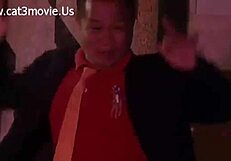 At a bar women seducively dance around while in ghost doll outfits and perform a striptease