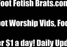 lesbian femdom lets submissive play with her feet