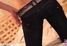 Teen babe slips off her skinny jeans, revealing panties underneath.