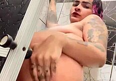 i watch sko ella in the shower showing off her tattooed pussy and tits