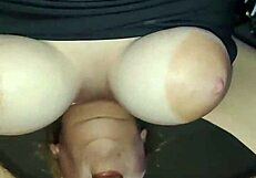 The milf with big dangling tits blows a cock