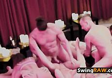 Amateur couples begin their sensual sex game. They kiss and play in group.