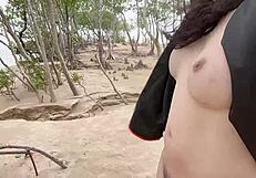 Ladyboy with big boobs pulls her cock hard in public view