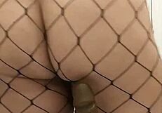 Chubby BBW rides dildo in fishnets