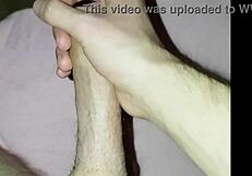 Young amateur massages his cock solo at home