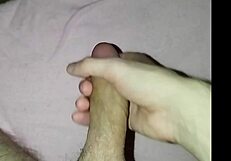 Young amateur massages his cock solo at home