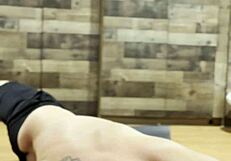 muscular bodybuilder stretches sexy body