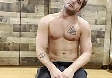 muscular bodybuilder stretches sexy body