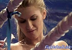 Oiled lesbian babes wrestle and lick shaved pussies