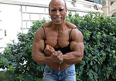 Muscular Women Biceps Flexing Power