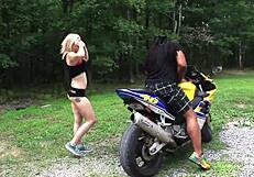 Nadia White has sex with a black man with a big penis outdoors while she straddles a motorcycle