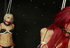 Sexy redhead and her blonde companion love being all tied up