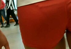 hot girl with nice ass in tight shorts arouses feelings in the market
