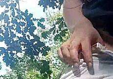 Young woman masturbates in the river unaware of the voyeur watching