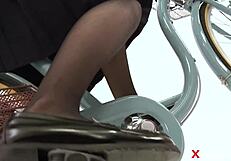 Japanese Girl in Uniform on Bicycle