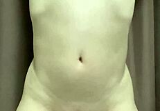 kinky japanese guy ties up his privates with string for thrill.