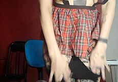 Naughty schoolgirl plays with toys casually