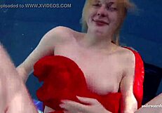 Russian teen Lucie enjoys underwater swimming in the pool.