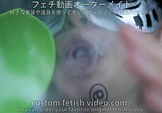 A woman inflating a float with air